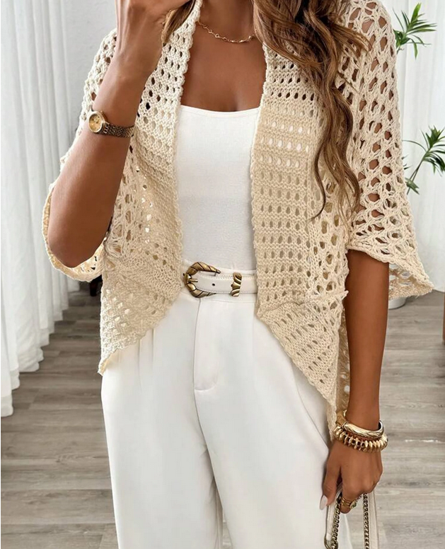 Beige crochet open-knit cardigan styled with white outfit